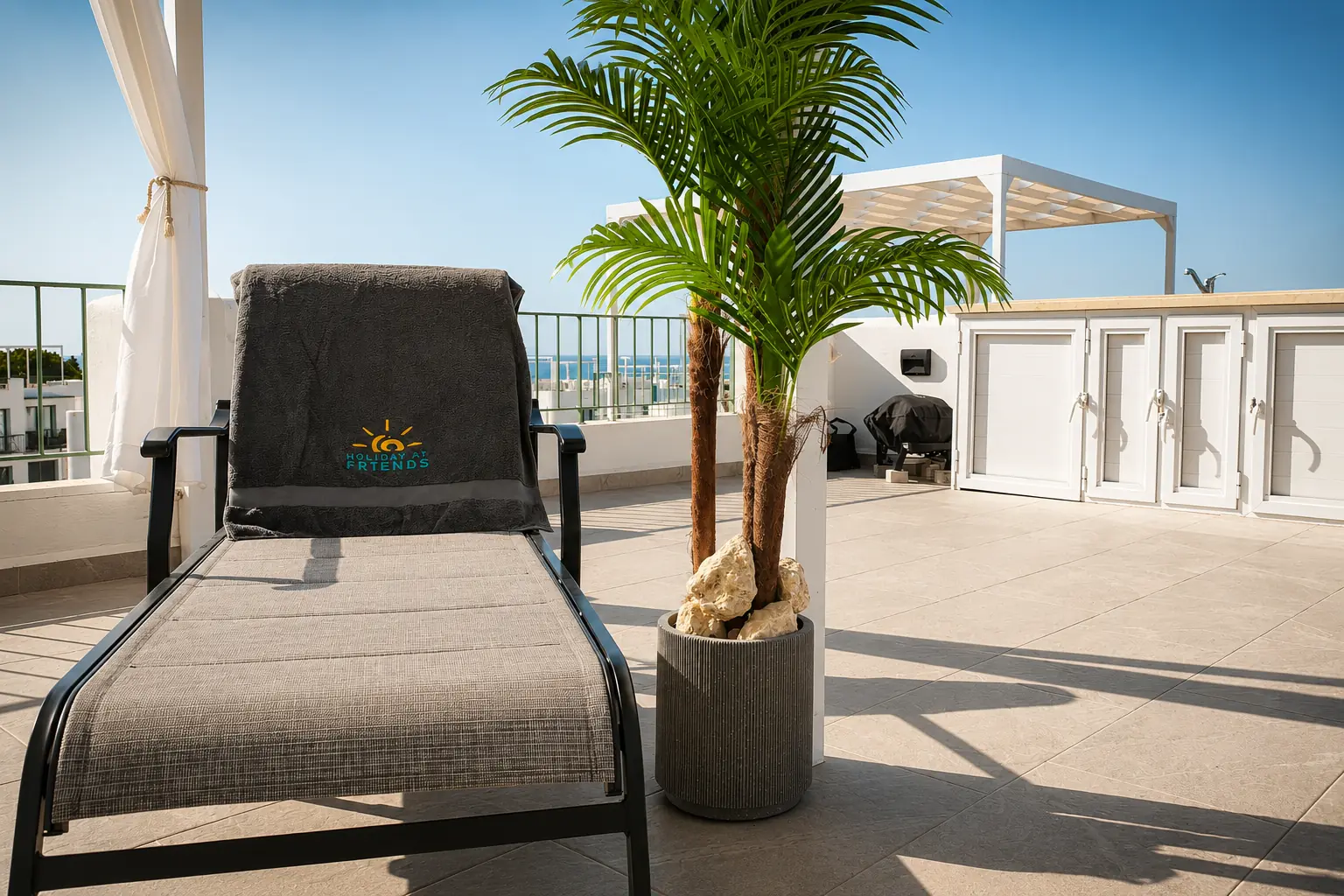 Lounge chair and palm on the Skyview terrace